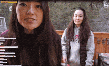 two women are standing on a balcony and one has a hoodie that says park city