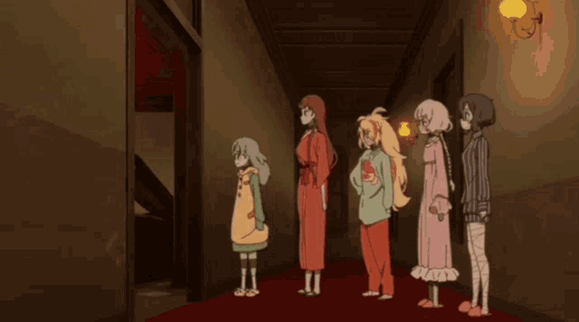 a group of anime characters standing in a hallway with one wearing a shirt that says ' a ' on it