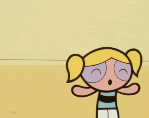 bubbles from the powerpuff girls stands next to a cartoon character