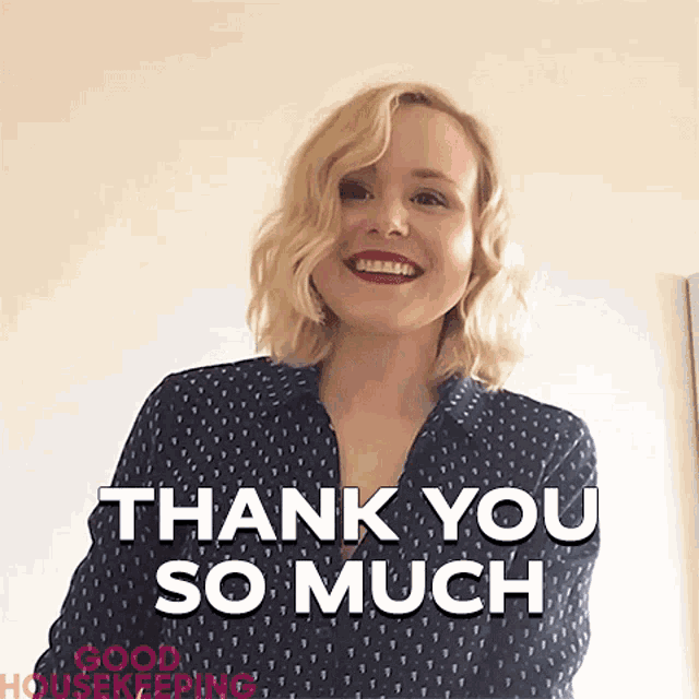 a woman in a blue shirt is smiling and says thank you so much
