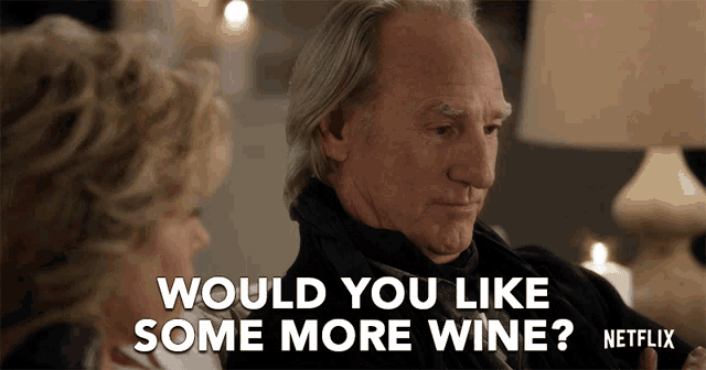 an advertisement for netflix shows a man and a woman talking and the man says " would you like some more wine "