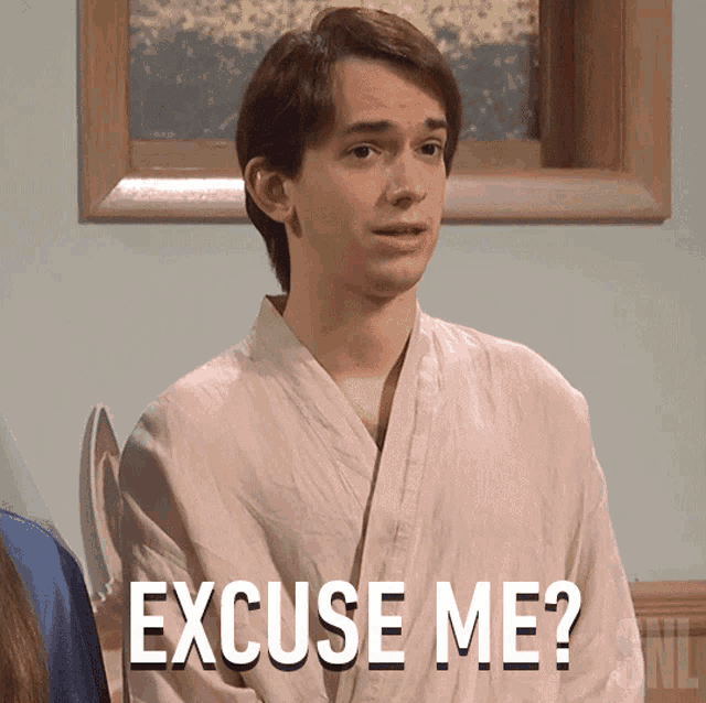 a man in a robe says excuse me in front of a picture