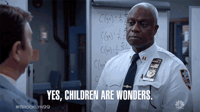 a police officer says yes children are wonders while talking to another man