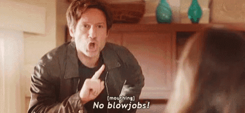 a man in a leather jacket is pointing at a woman and saying `` no blowjob '' .