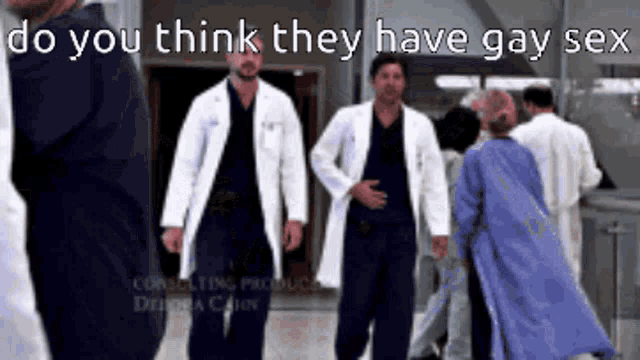 a group of doctors are walking down a hallway with the caption do you think they have gay sex