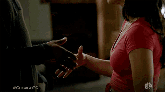 a woman in a red shirt is on nbc 's chicago pd