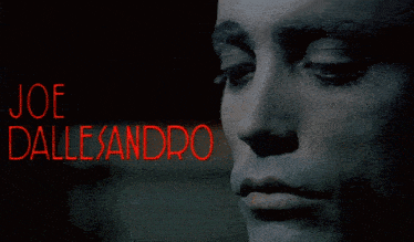 a close up of a person covering their face with the name joe dalleandro on it