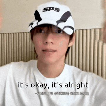 a man wearing a sps hat says it 's okay and it 's alright