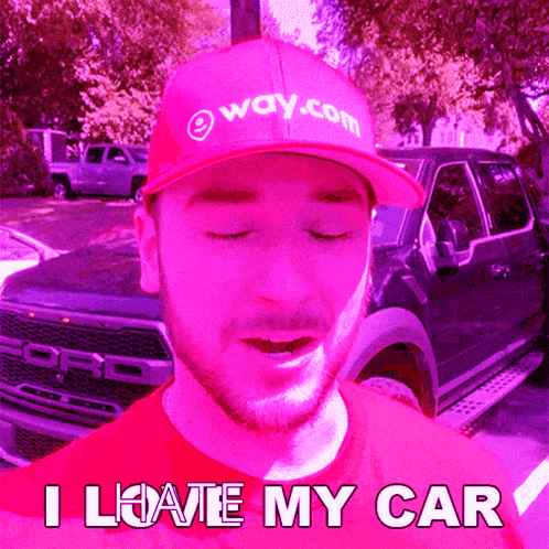 a man wearing a red hat that says way.com