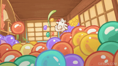 a gif from gifrun.com shows a bunch of colorful balls in a room