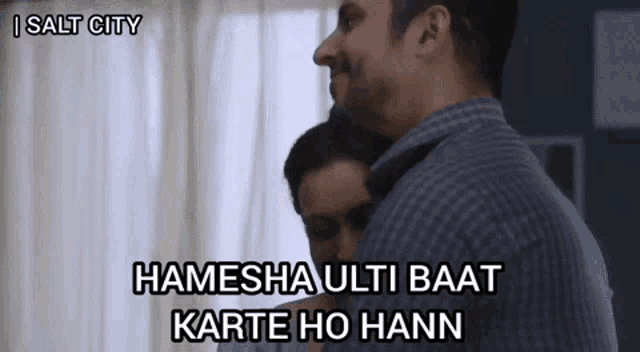 a man is hugging another man with the words hamesha ulti baat karte ho hann on the bottom
