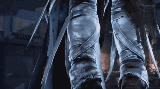 a close up of a person 's legs with a tv screen behind them that says teen.com