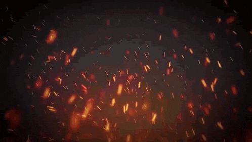 a dark background with a pyramid in the middle and sparks coming out of it