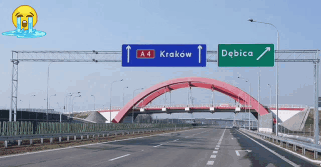 a highway with a sign that says krakow and a sign that says debica