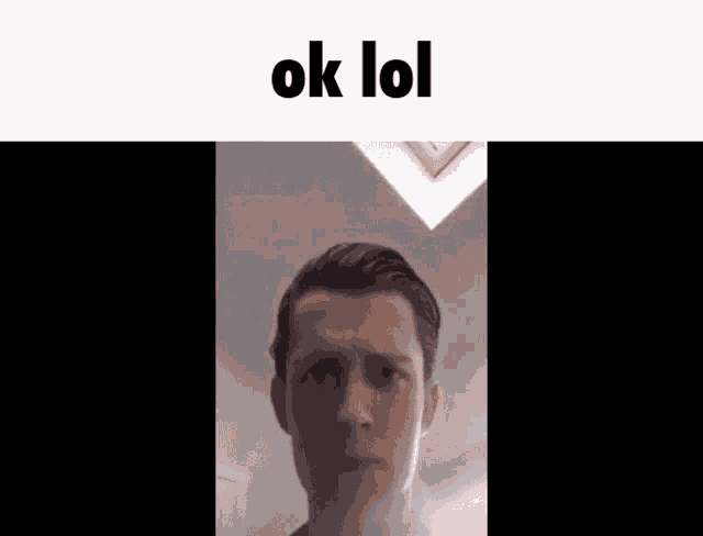 a close up of a man 's face with the words " ok lol " above him