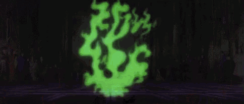 a group of people are standing in a room with a green ghost coming out of the ground .