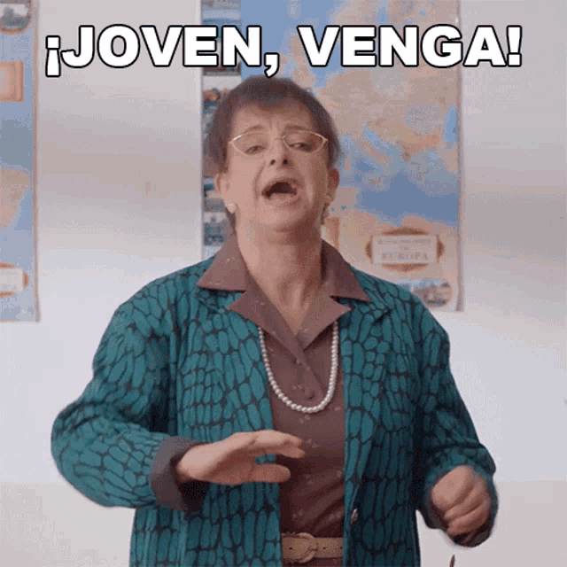 a woman with glasses and a pearl necklace is making a funny face and says joven venga