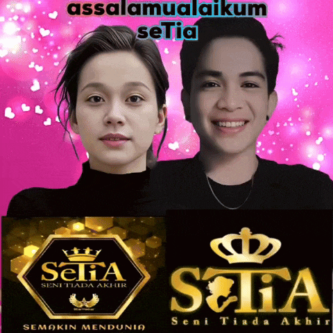 a man and a woman are standing next to each other in front of a pink background