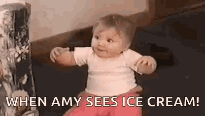 a baby is sitting on the floor with a box of ice cream behind him .