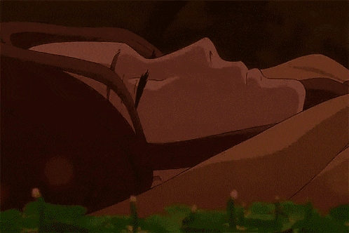 a person laying down with their eyes closed