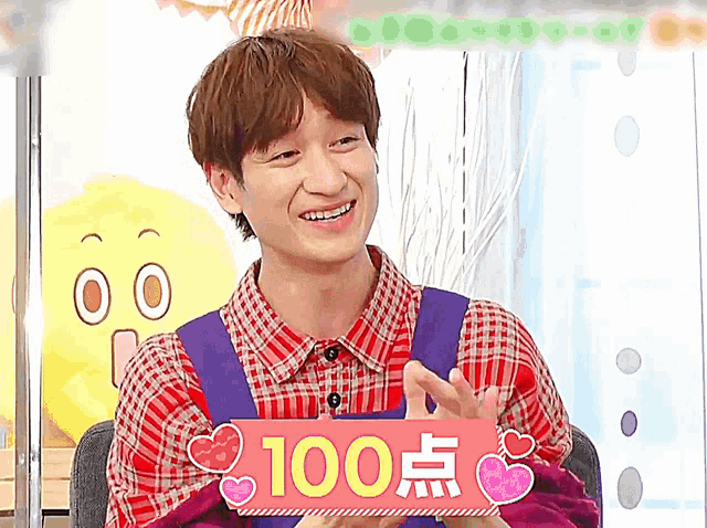 a man holding a sign that says 100 points