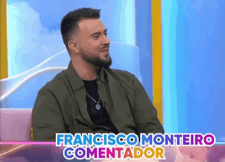 a man with a beard is sitting on a couch with the words francisco monteiro commentador written on the bottom .