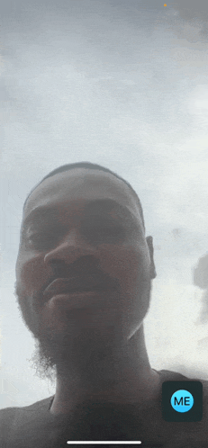 a close up of a man 's face with the word me on the bottom left