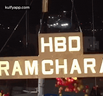 a sign that says hbd ramchari is hanging from a crane