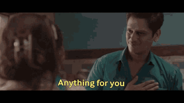 a man and a woman are talking to each other and the man is saying anything for you .