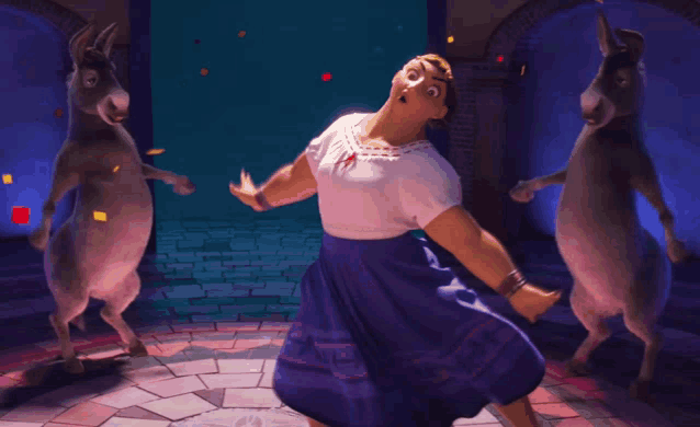 a woman in a blue skirt is dancing in front of two donkeys