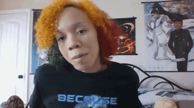 a woman is wearing a black shirt that says becrose