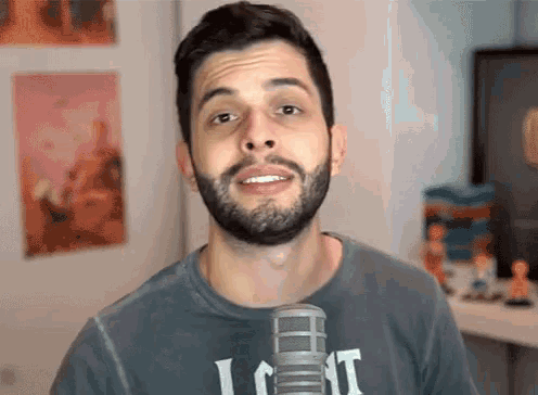 a man with a beard is wearing a shirt with the word lost on it