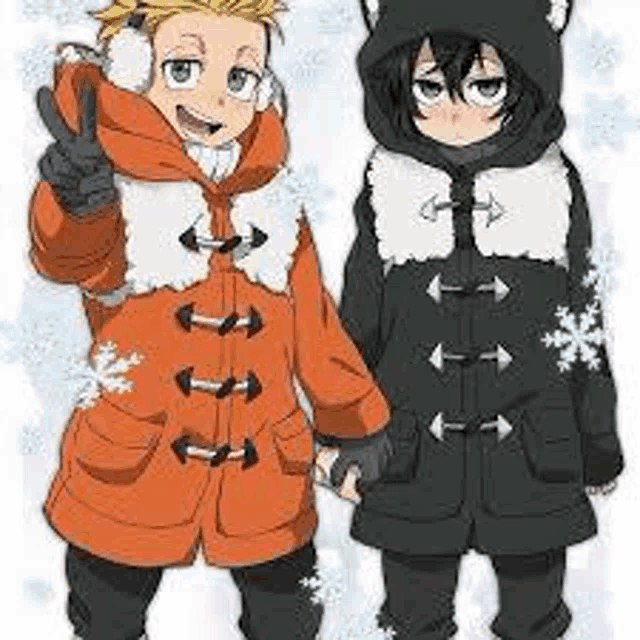 a boy and a girl are standing next to each other in the snow .