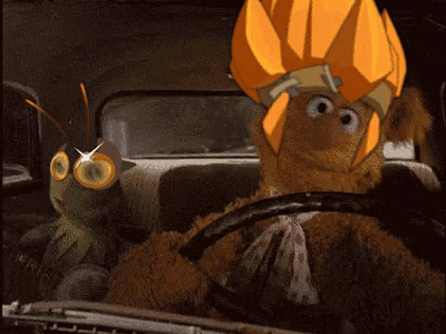 kermit the frog and mr. fozzie bear are driving in a car
