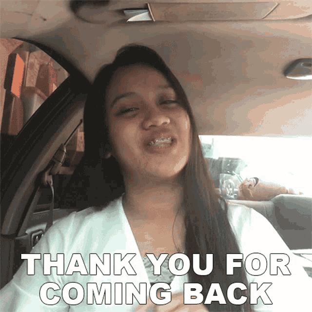 a woman sitting in a car with the words thank you for coming back above her