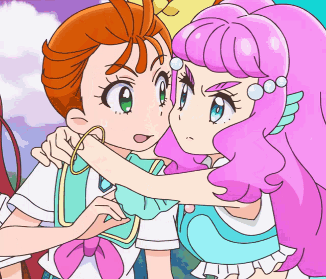a girl with pink hair is hugging another girl with brown hair