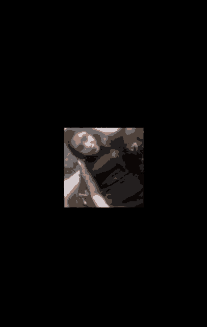 a woman in a black tank top is taking a selfie .