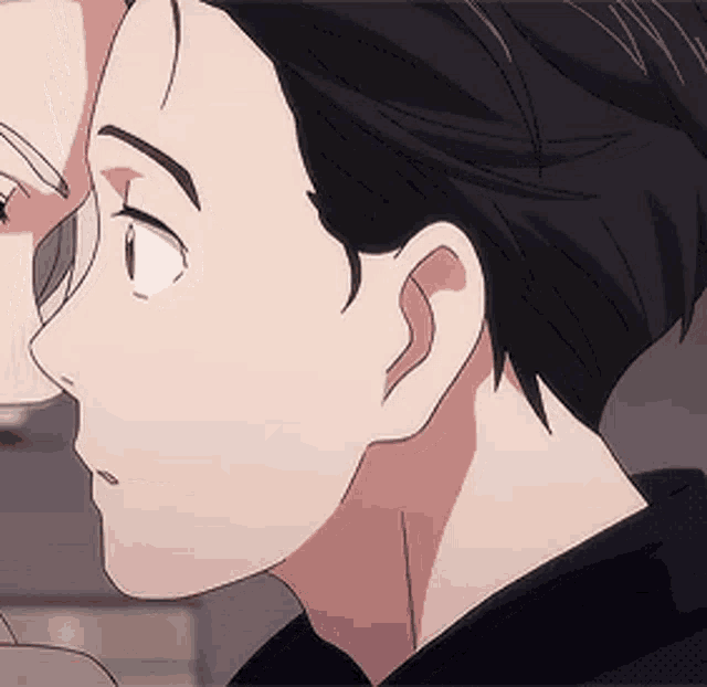 a close up of a person 's face with a woman 's face in the background .