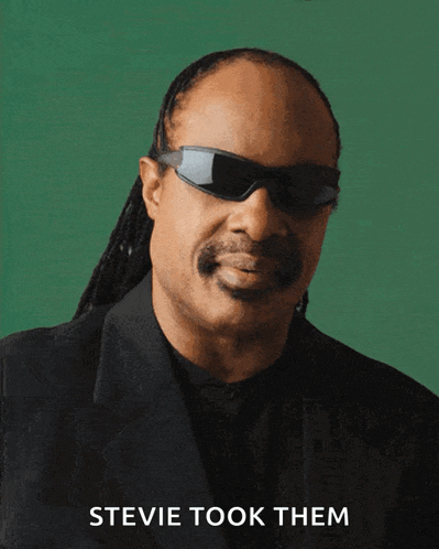 a picture of stevie wonder wearing sunglasses and a black suit