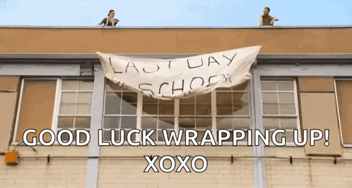 a banner on the side of a building that says " last day school "