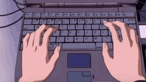 a person is typing on a laptop computer with their hands .
