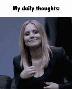 a woman in a black suit is smiling with her hand on her chest and says `` my daily thoughts '' .