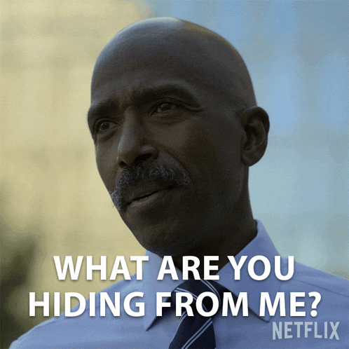 a man in a suit and tie says what are you hiding from me netflix