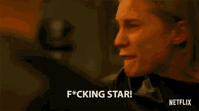 a woman is making a funny face and saying `` f * cking star ! ''