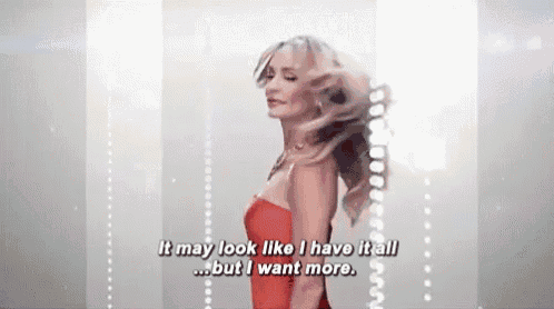 a woman in a red dress is talking about her hair .