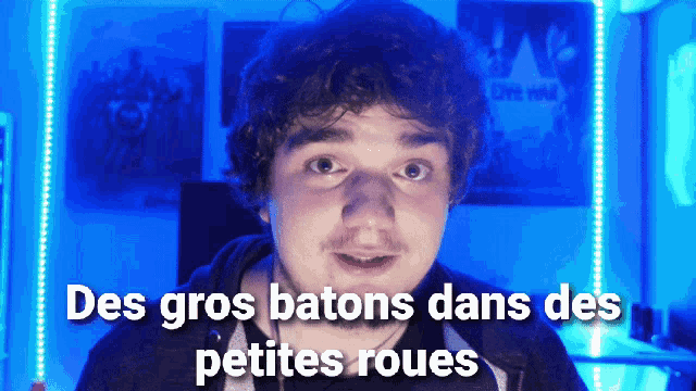 a man with the words des gros batons dans des petites roues