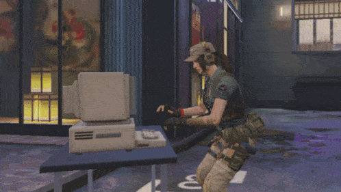 a woman in a military uniform stands in front of a computer that says ' n ' on it
