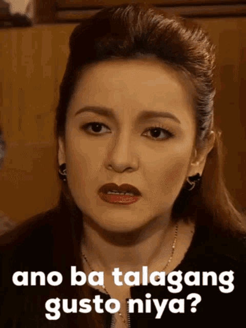 a woman making a funny face with ano ba talakang gusto niya