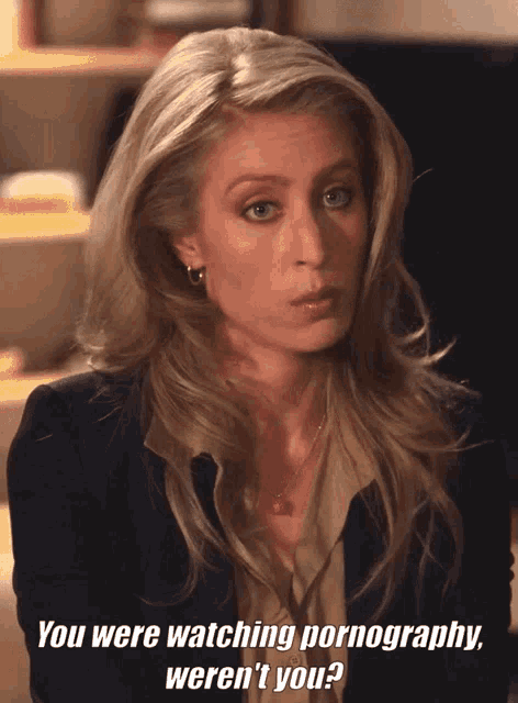 a woman in a suit says " you were watching pornography weren 't you "