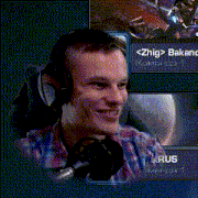a man wearing headphones is smiling in front of a screen that says < zhig > bakanc on it